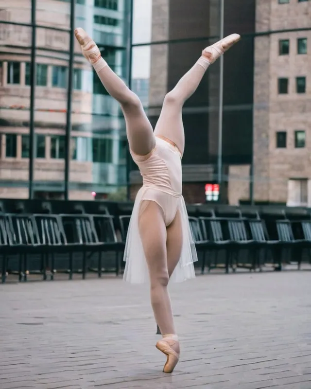 Balerina with one leg behind her head protesting against AI